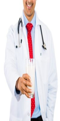 Doctor holding a glass of milk good for Osteoporosis and other bone deficiencies